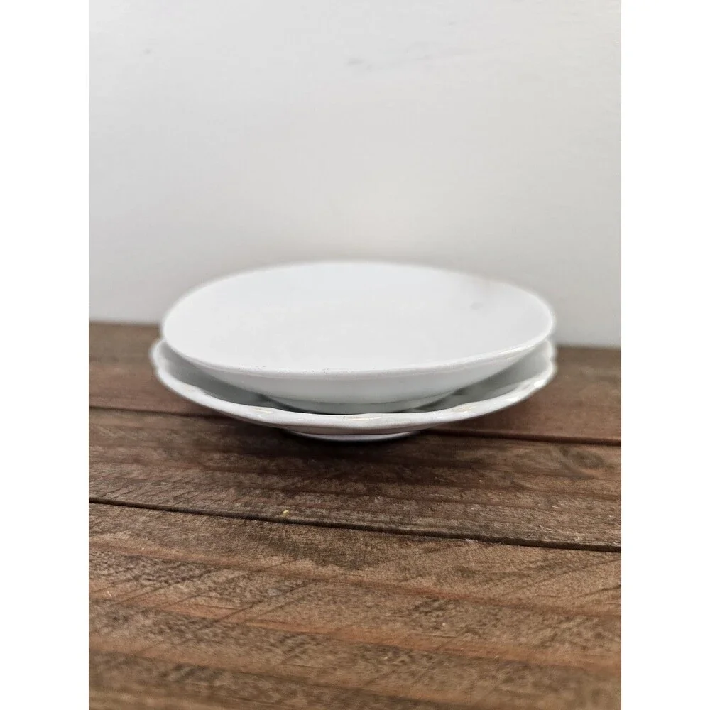 2 White Demitasse Saucers